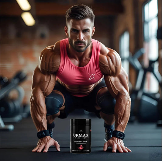 Muscular man in gym wearing pink tank top with URMAX Nutrition pre-workout supplement in front.