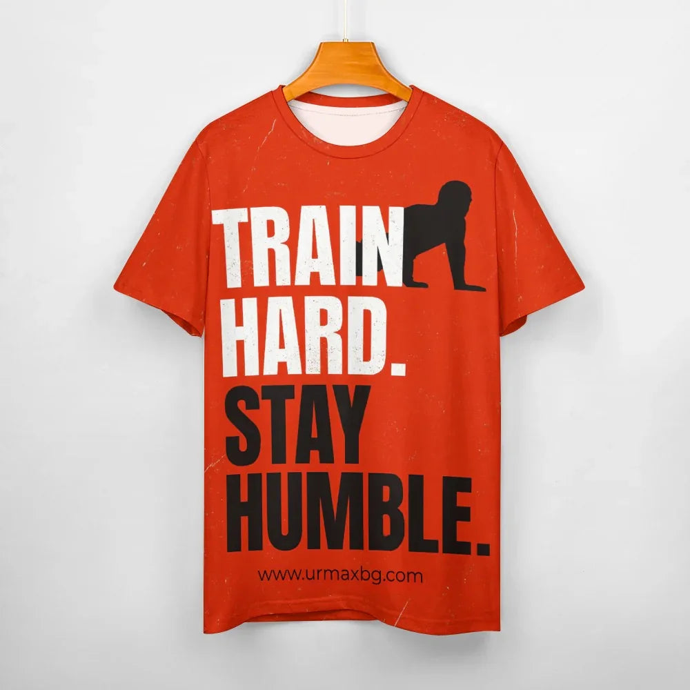 TRAINIERE HART. BLEIB BESCHEIDEN. – Motivations-T-Shirt für Herren (Feuerorange)