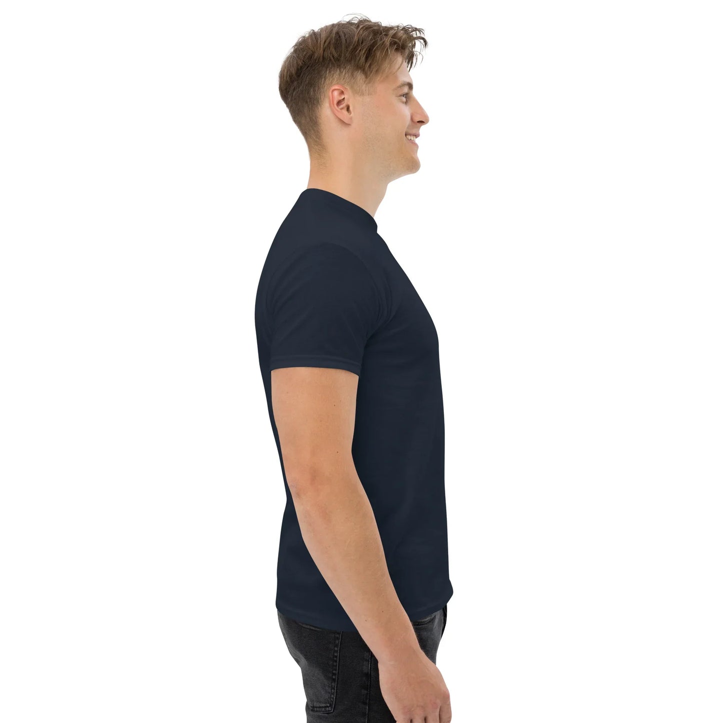 Man wearing a navy unisex classic tee, side view, plain background, urmax apparel