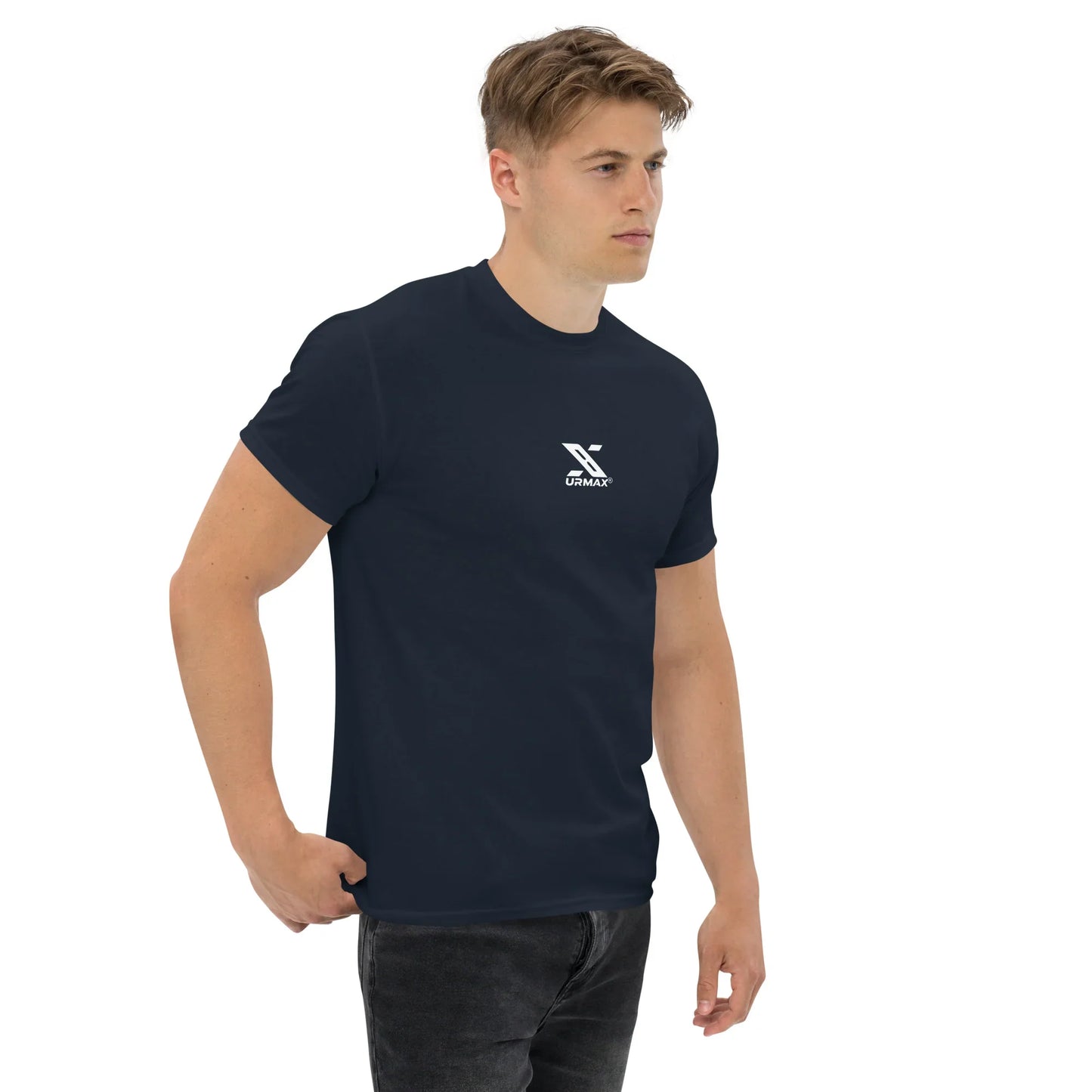 Man wearing navy unisex classic tee with white Urmax logo on chest, plain background.